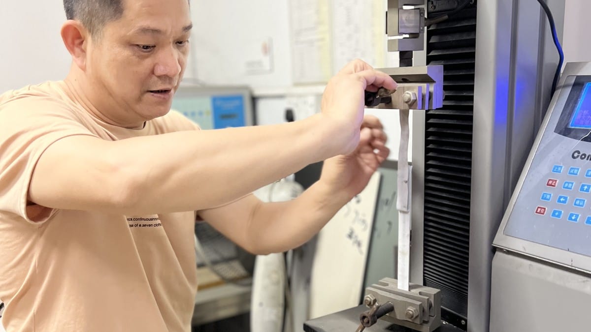 Technician performing an ACP peel strength test