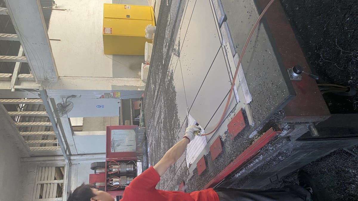 ACP sheet being routed on an Alcadex CNC processing table