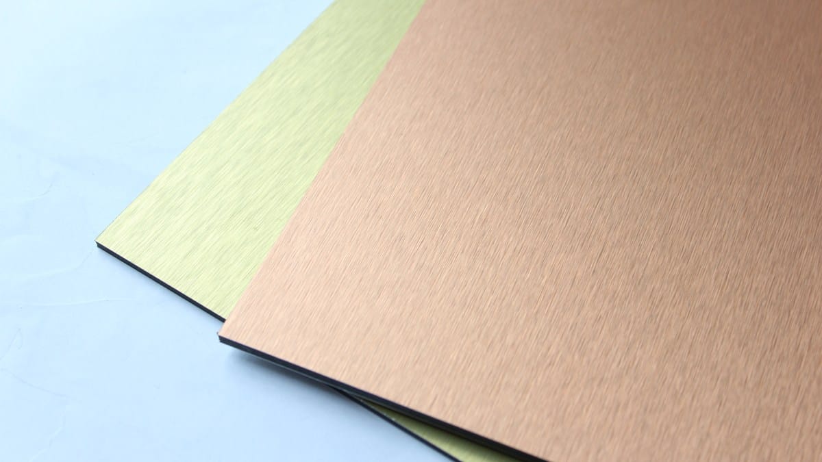 Real brushed ACP panel samples in bronze and gold tones