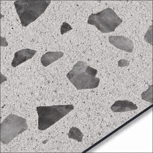 QSJ-0060 aluminium composite panel sample showing a light grey terrazzo-effect finish with darker stone-chip shapes